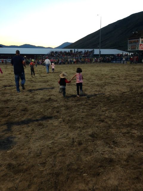 Macy & Luke heading out onto the field at the Jackson Hole Rodeo.